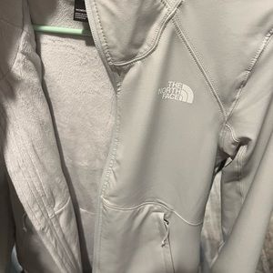 NorthFace cream colored coat with hood. Never used.